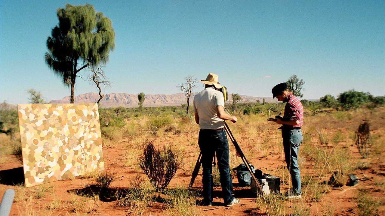 A film crew documenting art in the landscape